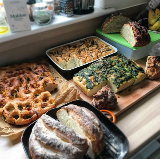 Table filled with different kinds of bread